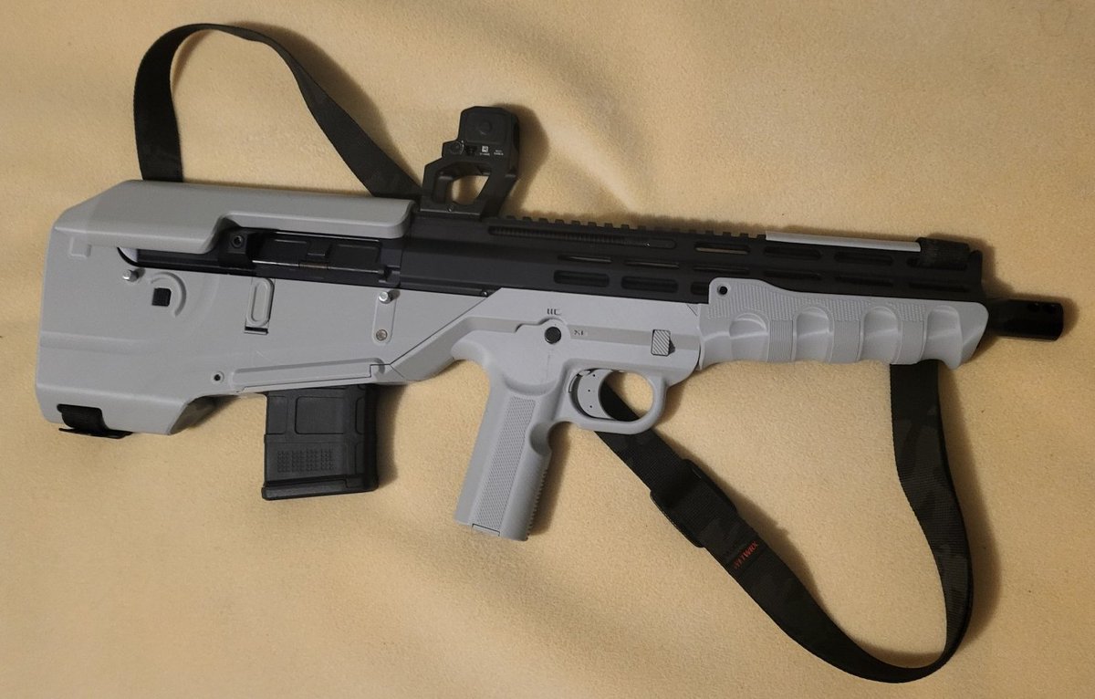ModeratorGage's tweet photo. Introducing the BB15 from developer 8762e13! This project is in a joint beta with BLC and Gatalog you can join either team to test this gun. This project is a bullpup chassis for bufferless AR uppers and BCGs (FM15, BRN180, Law Tactical ARIC) designed to be easy to build and durable over longer periods.  It uses only a standard AR15 parts kit and basic mcmaster components.  It has a plethora of modifications to increase longevity, like ring shims for the takedown pins to ensure a consistently tight lockup even after repeated disassembly, and DIY front pin reinforcement, doable with metal or with printable equivalents.