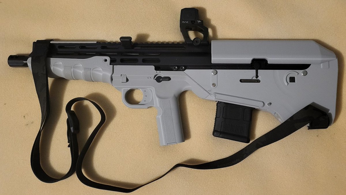 ModeratorGage's tweet photo. Introducing the BB15 from developer 8762e13! This project is in a joint beta with BLC and Gatalog you can join either team to test this gun. This project is a bullpup chassis for bufferless AR uppers and BCGs (FM15, BRN180, Law Tactical ARIC) designed to be easy to build and durable over longer periods.  It uses only a standard AR15 parts kit and basic mcmaster components.  It has a plethora of modifications to increase longevity, like ring shims for the takedown pins to ensure a consistently tight lockup even after repeated disassembly, and DIY front pin reinforcement, doable with metal or with printable equivalents.