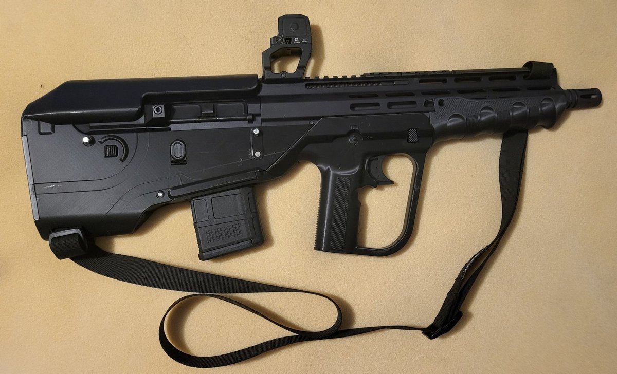 ModeratorGage's tweet photo. Introducing the BB15 from developer 8762e13! This project is in a joint beta with BLC and Gatalog you can join either team to test this gun. This project is a bullpup chassis for bufferless AR uppers and BCGs (FM15, BRN180, Law Tactical ARIC) designed to be easy to build and durable over longer periods.  It uses only a standard AR15 parts kit and basic mcmaster components.  It has a plethora of modifications to increase longevity, like ring shims for the takedown pins to ensure a consistently tight lockup even after repeated disassembly, and DIY front pin reinforcement, doable with metal or with printable equivalents.