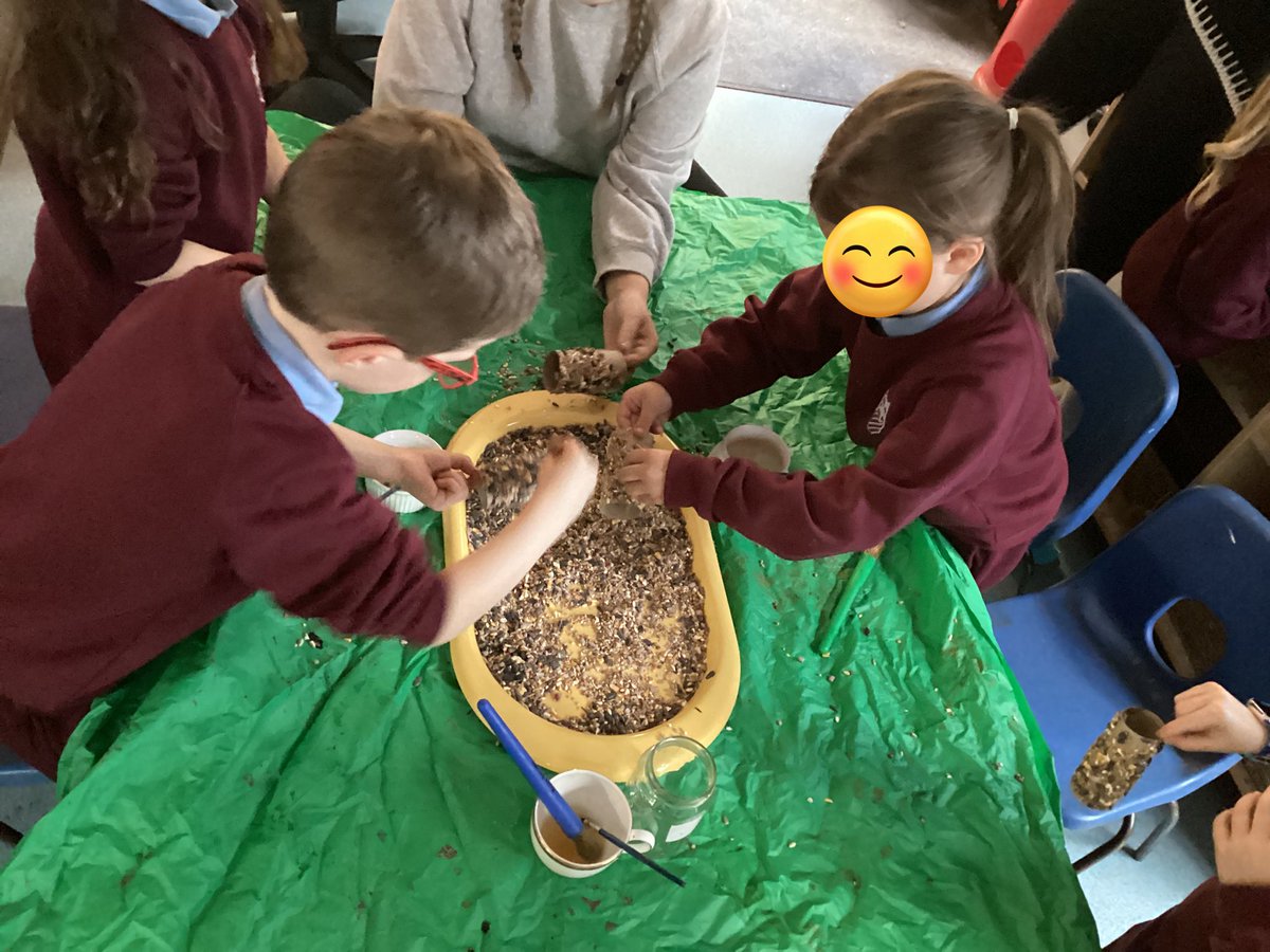 MrsPBHPS's tweet photo. Reception asked could they make bird feeders...so we did! They independently used different tools to spread honey and peanut butter onto cardboard and then rolled them into bird seed. After threading string through them, they hung them to trees. @BeaufortHillPri @EAS_EarlyYears https://t.co/Qn0dFdYgOc