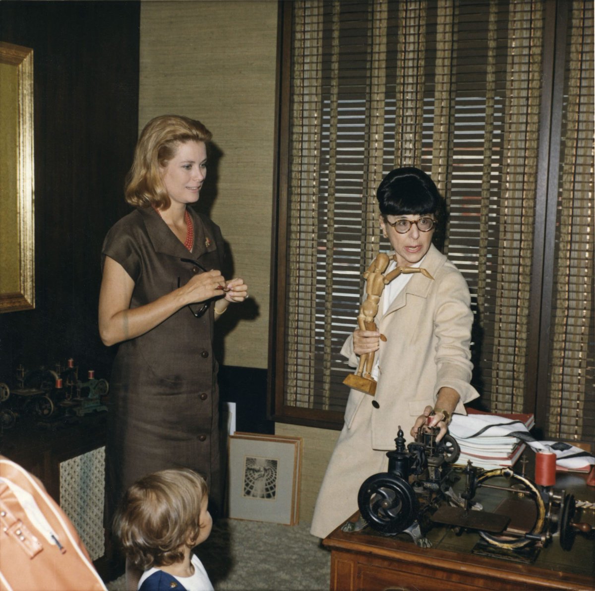 Grace Kelly with old friend, Edith Head, after Kelly became Princess Grace. The wee Prince of Monoco is in the foreground.