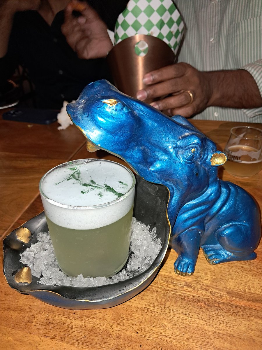 KaramjitV's tweet photo. Tried this Gin cocktail out last night in Bengaluru. It came complete with it's own hippo, edible glitter and foam. 
Good drink. But an even better conversation starter!
#cocktail #bengaluru https://t.co/Y9QobNAzX9
