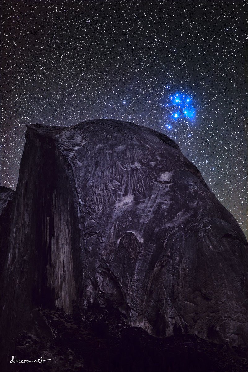 apod's tweet photo. Stars come in bunches. The most famous bunch of stars on the sky is the Pleiades, a bright cluster that can be easily seen with the unaided eye. The Pleiades lies only about 450 light years away, formed about 100 million years ago, and will likely last about another 250 million years. Our Sun was likely born in a star cluster, but now, being about 4.5 billion years old, its stellar birth companions have long since dispersed. The Pleiades star cluster is pictured over Half Dome, a famous rock structure in Yosemite National Park in California, USA. The featured image is a composite of 28 foreground exposures and 174 images of the stellar background, all taken from the same location and by the same camera on the same night in October 2019. After calculating the timing of a future juxtaposition of the Pleiades and Half Dome, the astrophotographer was unexpectedly rewarded by an electrical blackout, making the background sky unusually dark.

Image Credit & Copyright: Dheera Venkatraman