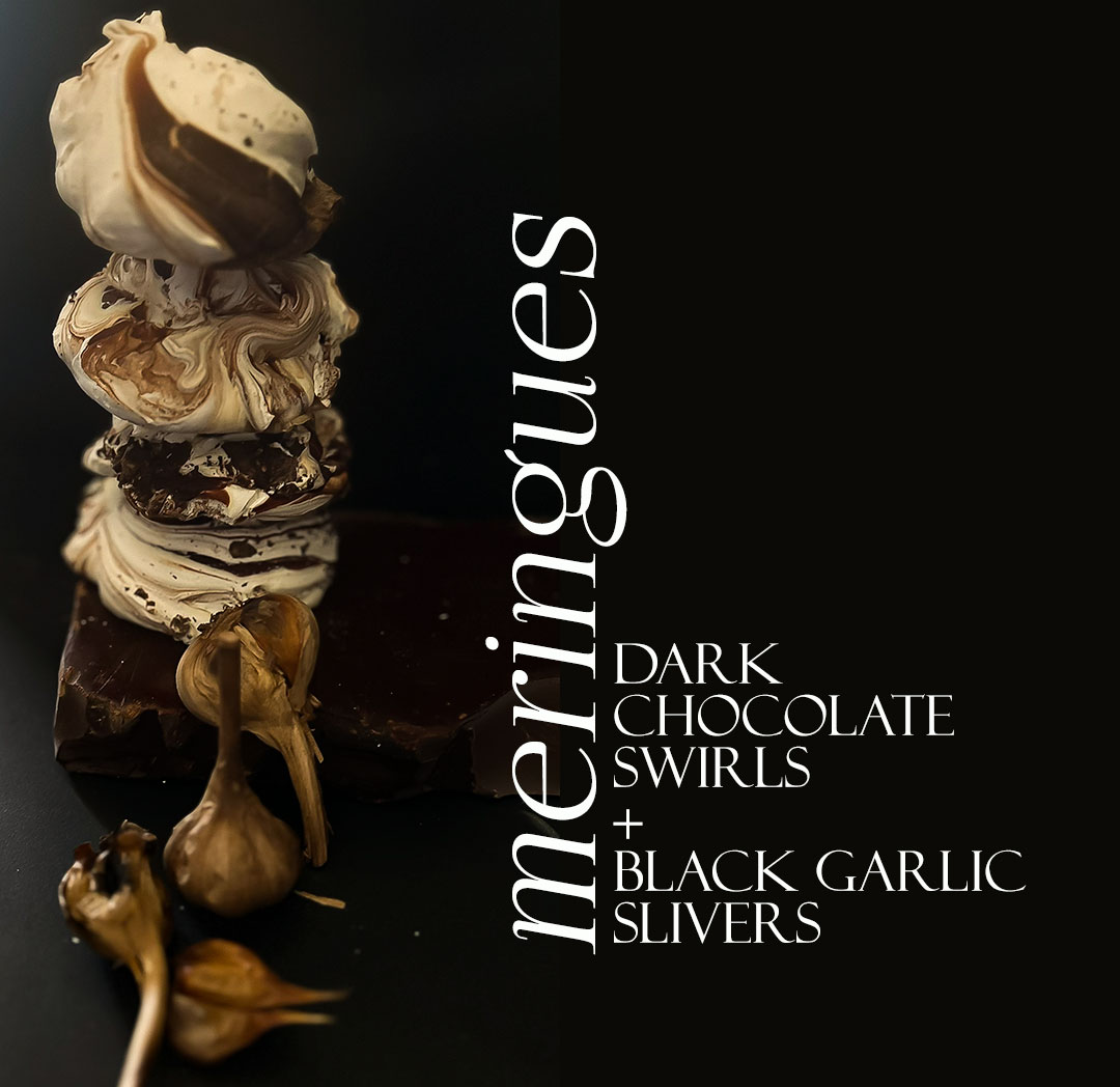 The Strong Food Company presents their Meringue Black Garlic &amp; Chocolate Trifecta: Soft, airy meringue and the enigmatic allure of black garlic lie hidden under the velvety covers of 70% dark chocolate—a seductive union of flavours that whispers of intrigue  every bite.