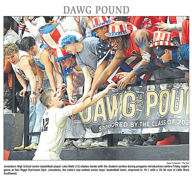 JPSHurricane's tweet photo. 🖤💛JPS "Dawg Pound" with #CaneBB player, Luke Baltz, featured on the front page of the SUN today! Open the Roof! Our top-ranking basketball team and our Dawg Pound cheering section is top notch! #CaneBB #CaneOTR @jb_hurricanebb https://t.co/Szu5GCc6mm