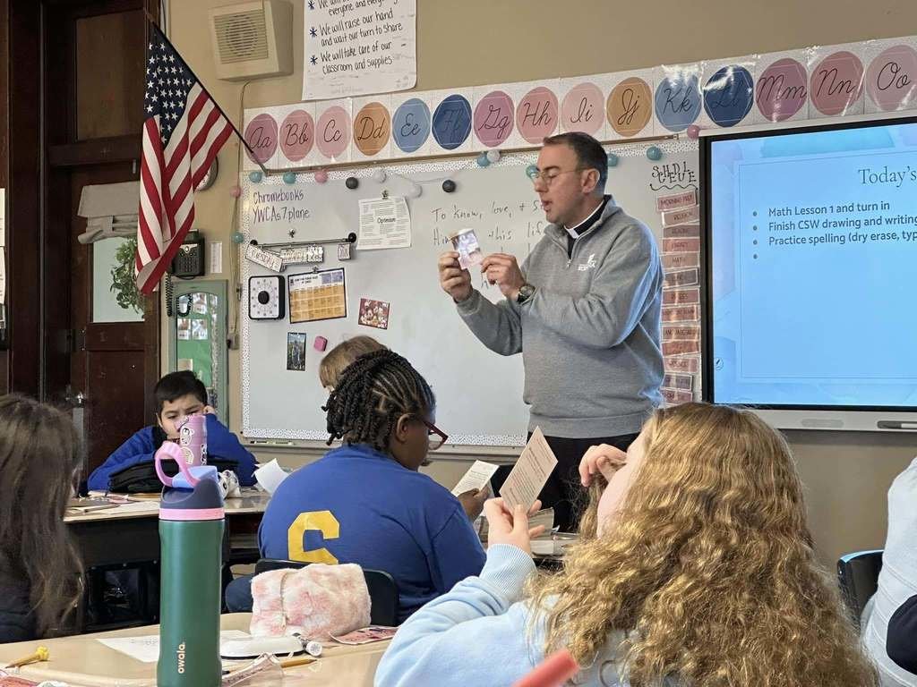 SMSPeoria's tweet photo. Father Lampitt came to share with our fifth grade class about his call to priesthood. We will continue learning about vocations this week in honor of Catholic Schools Week! https://t.co/76DShP5MmZ