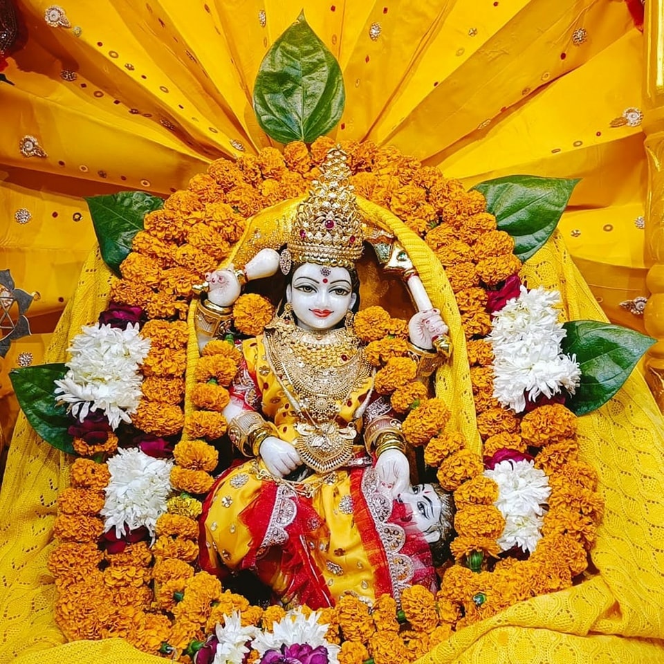 Maa Baglamukhi is propitiated with yellow offerings by devotees dressed in yellow, seated on a yellow cloth.