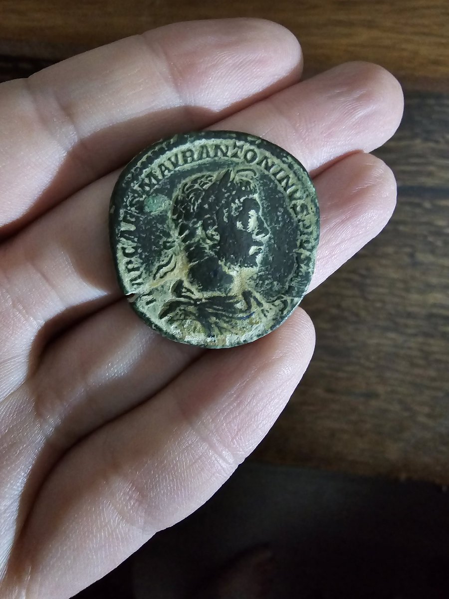 FemboyNumis's tweet photo. Bronze sestertius of Elagabalus, AD 221. The horned bust symbolizes their role as priest of El-Gabal. Reverse shows the emperor in ritual sacrifice, patera &amp; cypress branch in hand. Note the double strike, a minting error reflecting ancient production methods. https://t.co/ftjEJfLpKQ