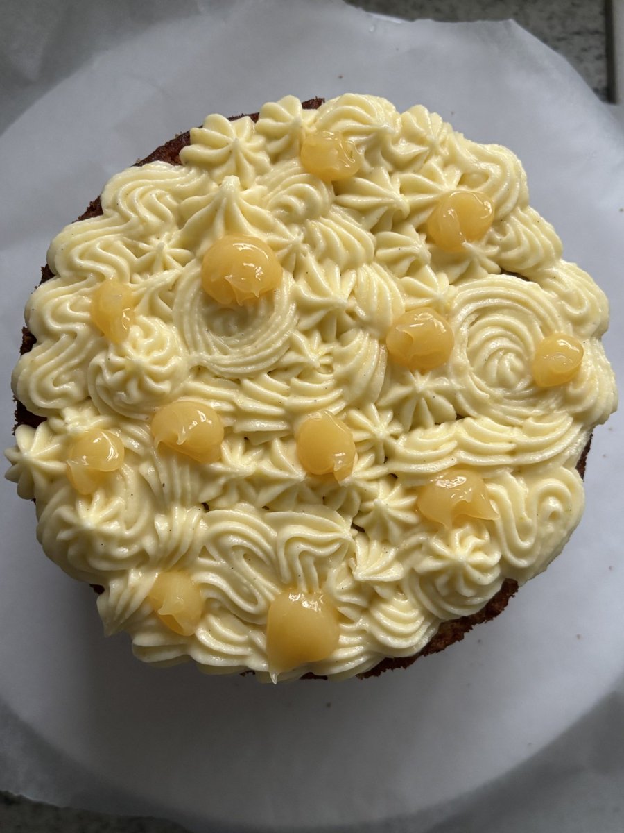 bakingenjoyer's tweet image. today i present to you: a lemon and vanilla bean sponge cake layered with lemon buttercream and lemon curd :)