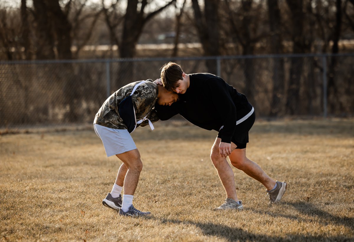 allysonschwab's tweet photo. There is always a way to get better if you seek it out. 

Today UNI got outside to get some sunshine and fresh air.  It is not often it is 48 degrees in the middle of January in Iowa. I looked around and spotted Paez, arm in a sling, working on his stance and motion with Wade who is banged up as well. They had every reason to not get up and do something. Hell, Wade is a senior and hurt and is still out there helping his teammate get better.

It brought me back to how many times I’ve witnessed someone say, “Well, I’m hurt, I can’t do that,” or “What’s the point of coming if I’m not at 100%?” It wasn’t until being around my husband, a guy who had some injuries in HS, that I really understood all you can accomplish within the time you can’t participate (how you want) or compete. One thing is for certain- it is not talked about enough.

I think kids struggle the most when injured because they are used to the attention they get when they are not injured. Valid right? I think more coaches could highlight ways that ground can be made regardless if it’s on the mat or on the sidelines. Some of that being mind work, nutrition work, spiritual work, journaling, visualization, video review, or simply watching an individual and asking questions- working to understand the technique more. I know doing any of that takes a lot of discipline. We all know it is a lot easier to feel sorry for yourself and not do any of that. I’m not saying you aren’t allowed a pity party or two, but I’m saying you can’t sit there forever.

One thing I know is true - whether you are injured or not we view improvement on a scale that wasn’t meant for improvement. Improvement a lot of times is only tethered to results or the black and white of success or failure. You can fail and still have improved.  To improve means to make better. It didn’t say to become #1 overnight, it didn’t say jump to three a days and just work harder, it is defined as make or become better.

The thing I feel holds us back from improvement is the lack of appreciation for the smallest of steps forward in bettering ourselves. Rome wasn’t built in a day, but did they stop building because it wasn't? No. So why do we look at results to measure improvement in a span day or two and not over the course of weeks, months, years? Im guilty of it. I’m an all or nothing type of girl- my perfectionist really shows out. I’m going to be the best or I’m really going to struggle with not being the best and it’s a battle I fight daily. It is a lot harder to continue to make small improvements when all you see is the mountain ahead and your brain is asking you why you can’t move faster. So I get it, but am I better at how I navigate that than I was 5 years ago - yes. 

Now as a parent looking back on my own career I realize just how much improvement could have come from doing 10 minutes of something extra each day. It's not always the time you put into improving as much as it is the focus, the effort, the attitude, the discipline you put forth within that time. All this to say- to those few athletes that read this- yes an injury may keep you out of the game, the match, off the playing field, but it doesn’t keep you from improving your craft in other ways. Seek to improve. 

photo by me.