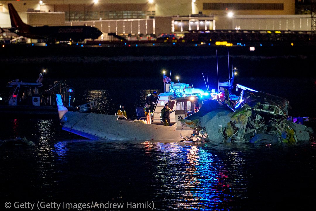 Emergency response teams including Washington, DC Fire and EMS respond after an American Airlines flight from Wichita, Kansas  collided with an Army helicopter while approaching National Airport on January 30, 2025  in Arlington, Virginia. (Photo by Andrew Harnik/Getty Images)