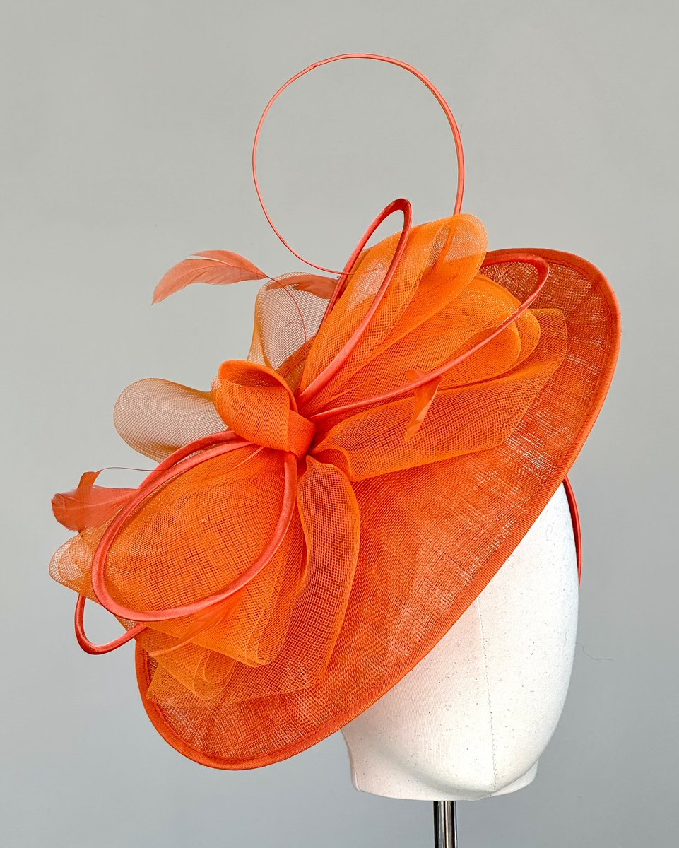 Hat of the week
We are enjoying the sunshine here today so have chosen a bright orange disc, finished with crin bow &amp; curled quill 
#hatoftheweek #hat #headpiece #disc #orange #brightorange #hatshop #hathireshop #hathire #hirehat #hats #hatsyle #louiseclairemillinery