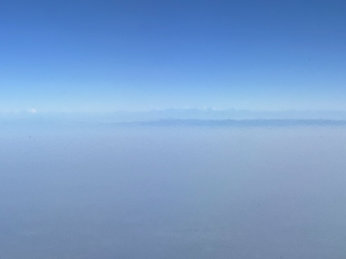 On a Dec morning, peeking out from the right window on a LKO-DEL leg, one can be surprised that the horizon line seems jagged and straight 

The camera zoom unveils the Himalyas 🏔️