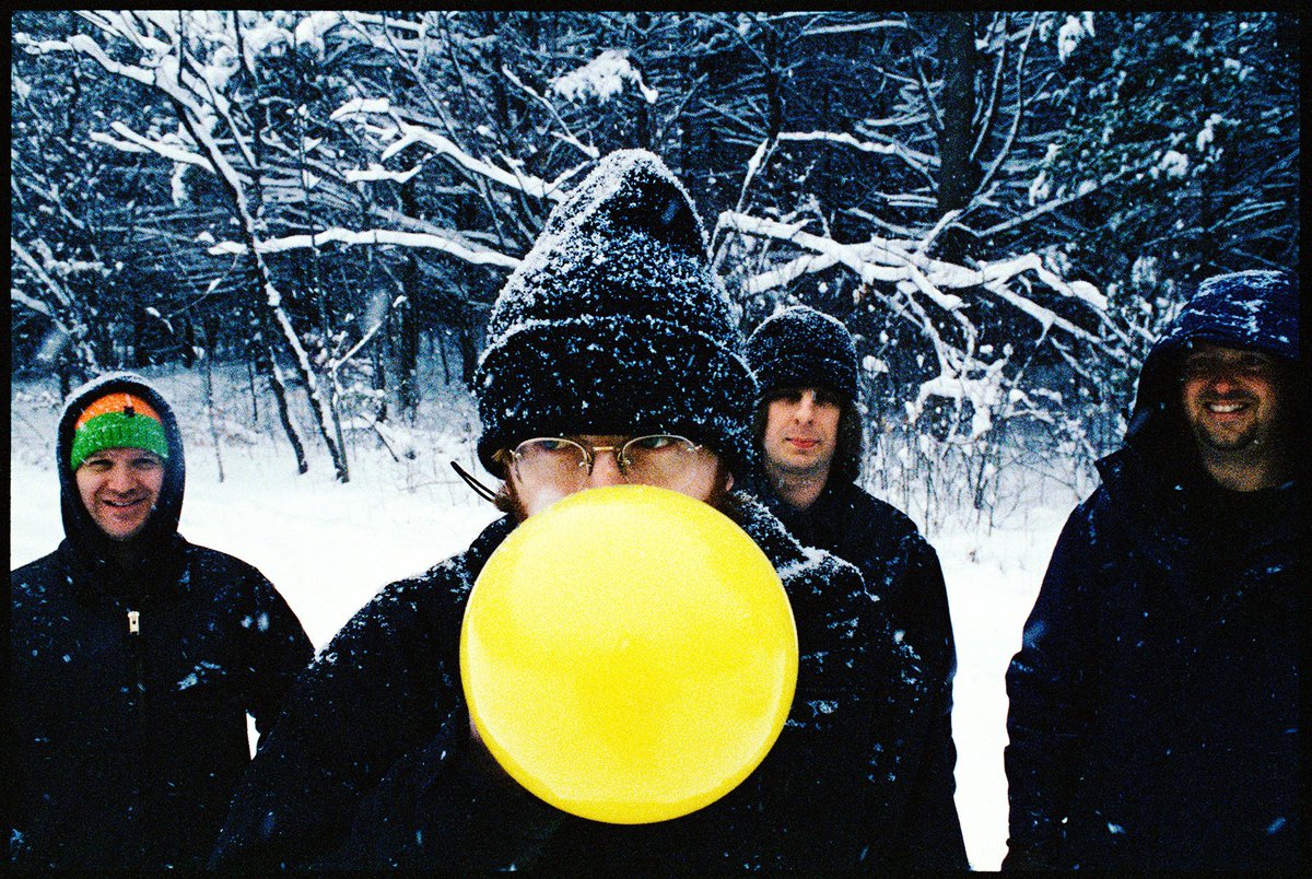 Phish in Burlington VT , 25 years ago this week ! We were up at Fishman’s house doing a session for publicity and it started to snow - which we didn’t expect at all - so we thought it would be awesome to go outside and snap some photos . Everyone in the band was grabbing