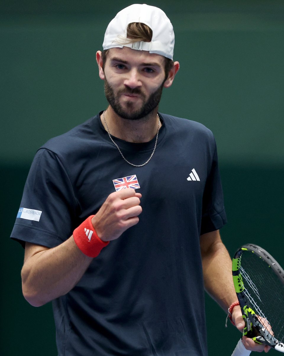 Photo of Jacob Fearnley fist pumping in celebration during his Davis Cup debut