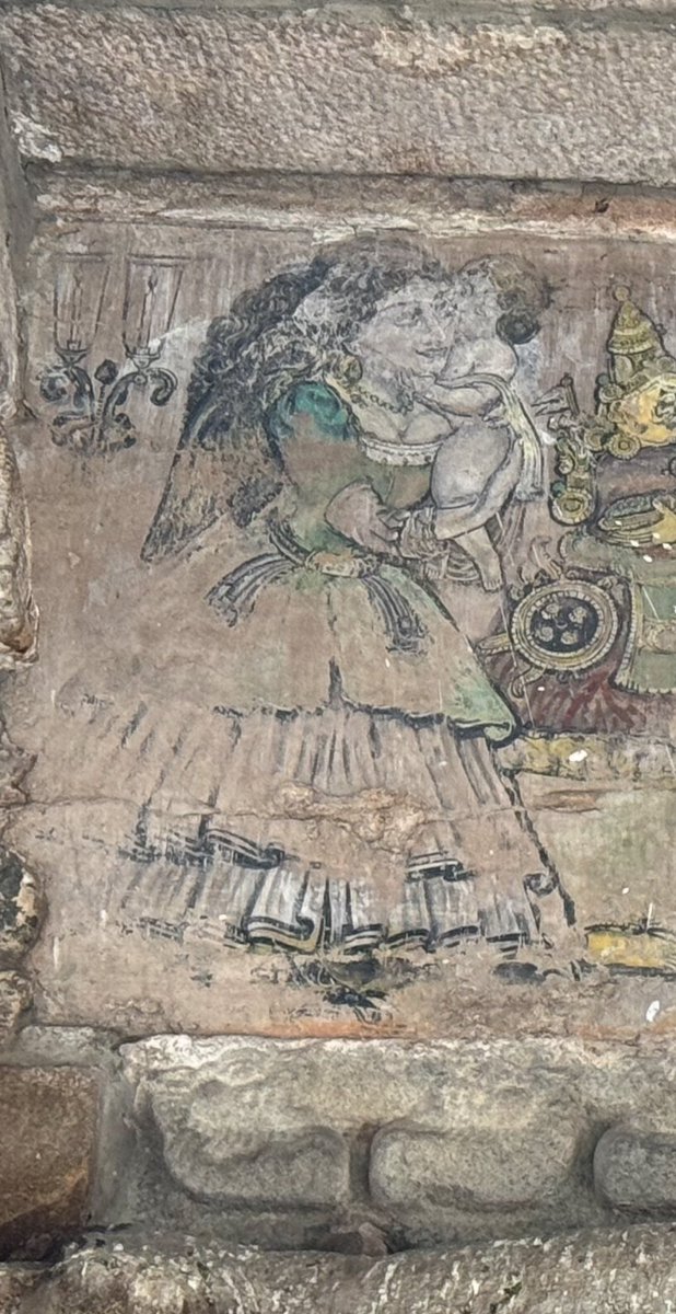 _agnel_'s tweet photo. On a recent visit to Thiruvarur Thiyagaraja Swamy temple, I found this mural on the ceiling of the corridor. It probably depicts the goddess with two angels holding a child. 

Interesting, wonder any background story to these. Could be a Nayaka period mural? https://t.co/9tQux0EbMx
