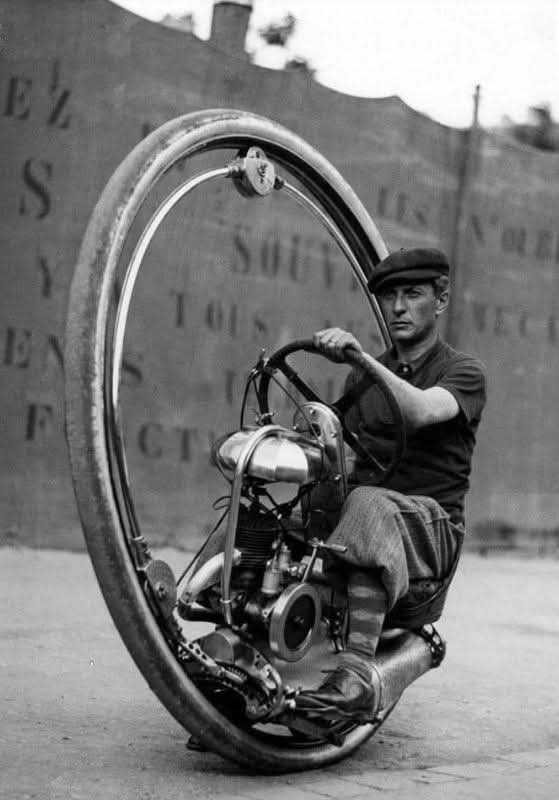 histories_arch's tweet photo. In 1931, M. Goventosa de Udine introduced a groundbreaking invention: the one-wheeled motorcycle. This unconventional design defied traditional motorcycle engineering, which relied on two wheels for stability. Instead, Goventosa’s creation featured a single, massive wheel, challenging perceptions of balance and control while showcasing the era’s innovative spirit. It was an ambitious leap in transportation design, reflecting a bold attempt to rethink personal mobility in a rapidly changing world.  

Although the one-wheeled motorcycle never became a practical mode of transport, its creation symbolized the early 20th century’s fascination with futuristic technology. Engineers and inventors were constantly pushing boundaries, experimenting with alternative forms of transportation. The challenges of maintaining balance and maneuverability ultimately prevented widespread adoption, but the concept fueled further exploration into unique vehicle designs.  

Despite its limitations, the one-wheeled motorcycle remains a remarkable piece of engineering history. It serves as a testament to human ingenuity and the relentless pursuit of innovation. While it may not have revolutionized transportation, it stands as a reminder that progress often comes from daring ideas—even those that seem impractical at first glance.

#archaeohistories