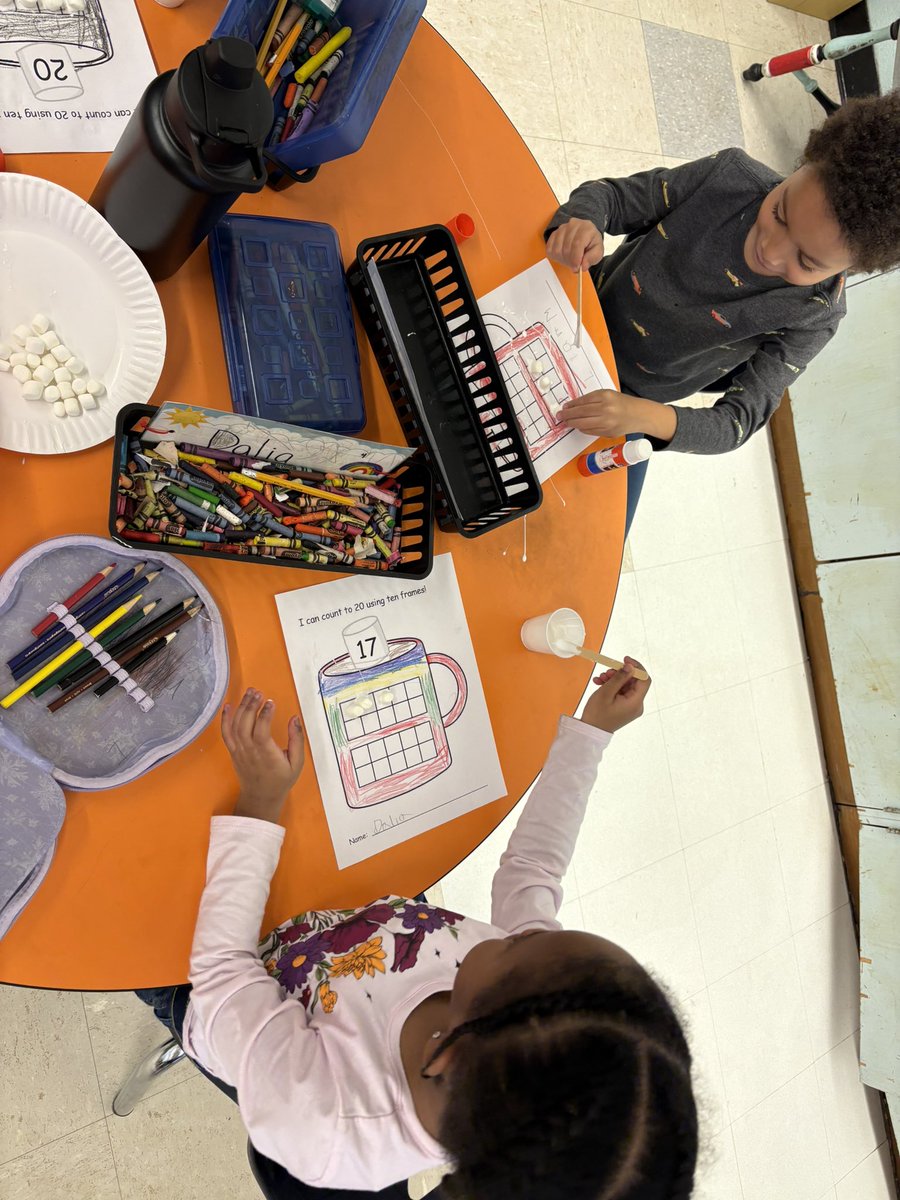 Counting with marshmallows on hot cocoa ten frames for #NationalHotChocolateDay !