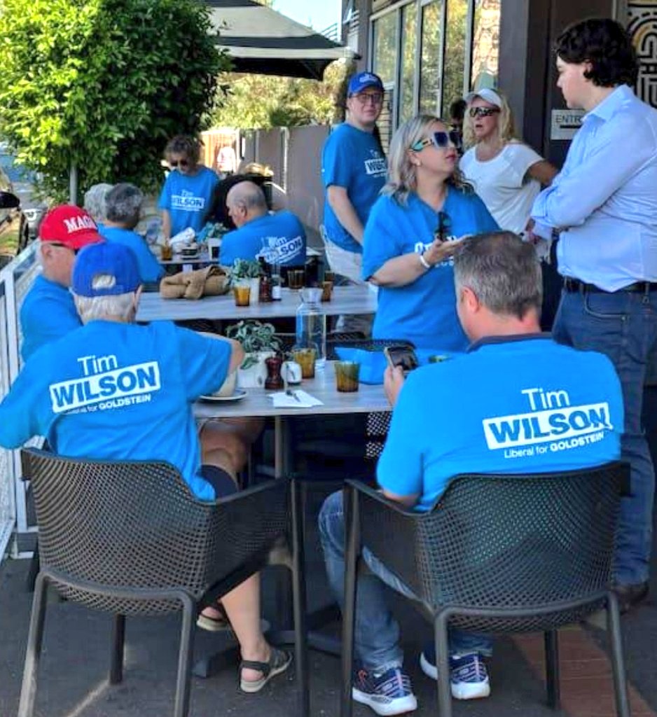 anth0888's tweet image. For context this was extracted from this bigger picture.

And yes that's Goldstein Liberal candidate Tim Wilson @tw4goldstein sitting down on the right hand side with his phone and back to the camera, at the same table of Mr "red MAGA hat".

Tim Wilson is NOT a moderate. #auspol