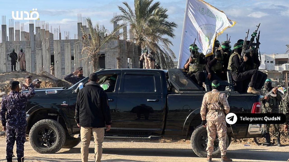 SuppressedNws's tweet photo. ⚡️BREAKING:

As the fourth batch of the prisoner exchange is underway, hundreds of Al-Qassam fighters are present at Gaza’s port the resistance gathers in thousands, with a poster on the stage reading: “zionism will never win.”

The vehicle displayed belongs to Israel, it was confiscated by the resistance in the Gaza Envelope on October 7 2023. [IMG2]

Today, the Al-Qassam Brigades used this vehicle to release the hostages, as part of the Flood of the Free prisoner exchange deal.
