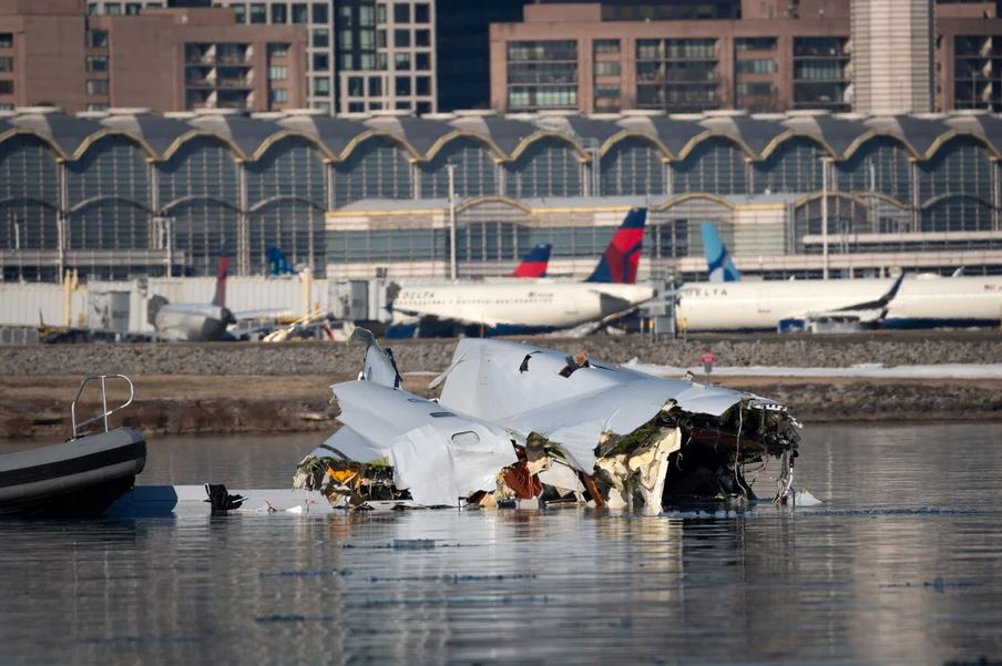 JJnPhoenix's tweet photo. I see a grieving Mom with her hair in a bun crying into her hands while looking at the water and wreckage.   So sad!  RIP to all  #aa #airline #crash https://t.co/CY2WSzsTCu