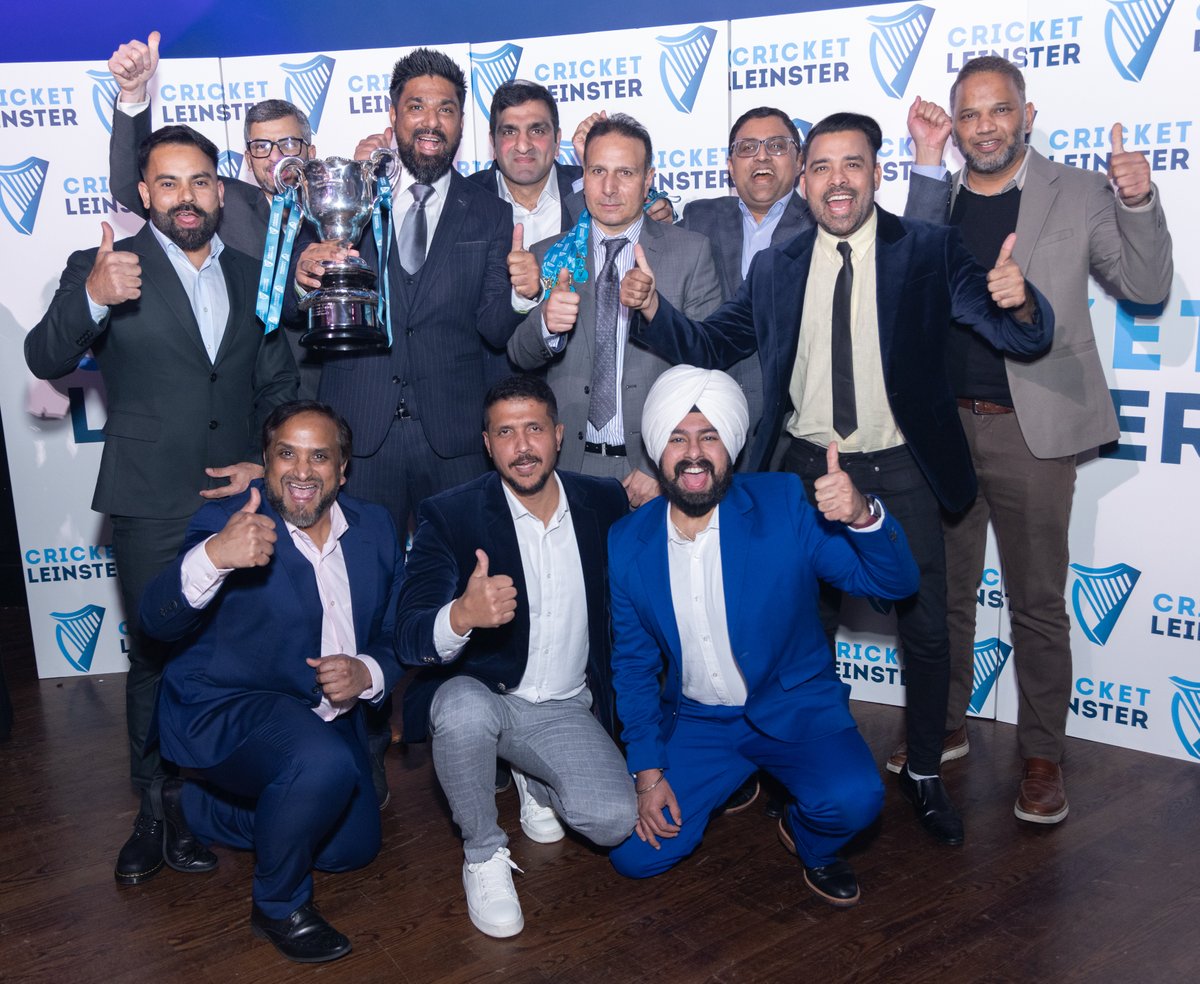 Castleknock Team 1 captain Yaz proudly holds the Division 6 Trophy at the Cricket Leinster Gala Night (2025) in Mansion House, Dublin, celebrating the team's remarkable achievement alongside teammates and club members, This is back to back league victory for Castleknock top team