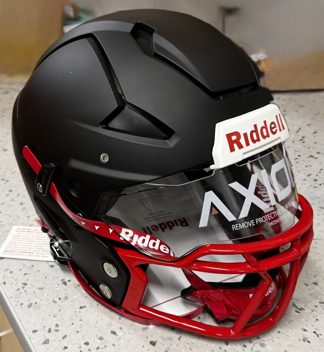 Titans Football Director of Equipment, Coach Warren is fitting out C/O 27 WR/DB Mike Mathis with a new Riddell Axiom helmet. We would like to thank Athletic Director Barry Hickingbotham, Supt. Dr. Owoh for the support in giving our players what they need to be safe.