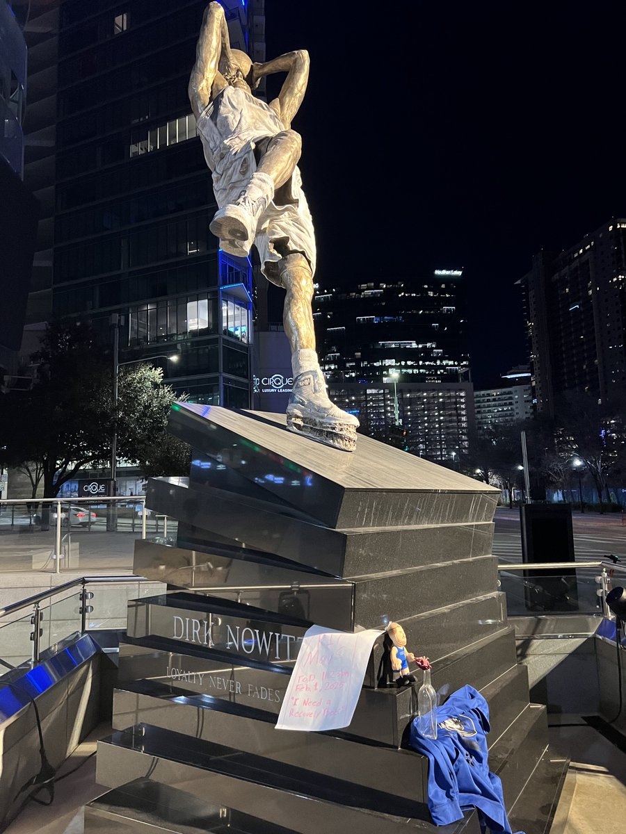 MavsMuse's tweet photo. The Dirk statue has become a Mavs fan memorial https://t.co/IRSYqU8Sz0