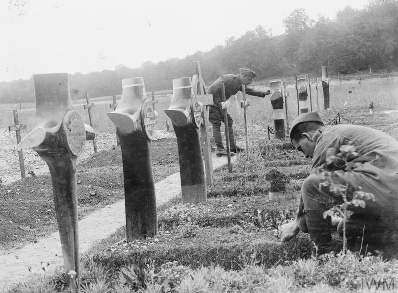 War graves of airmen near Hesdin (Huby-St. Leu). In several cases four bladed propellers are used as headstones, 14 July 1918. IWM (Q 12095)