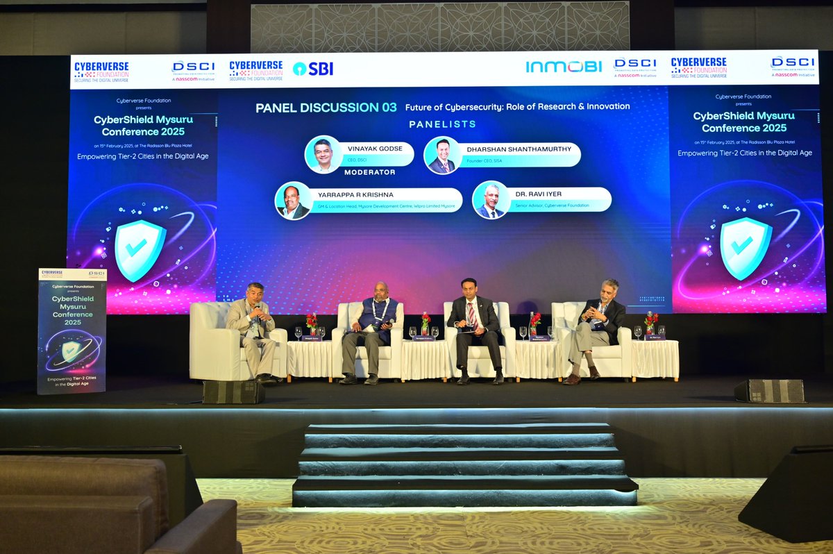 MCyberverse's tweet photo. At CyberShield Mysuru 2025, a panel on "Future of Cybersecurity" featured Dharshan Shanthamurthy (SISA) on indigenous tech, Yarrappa R Krishna (Wipro) on Tier-2 cities driving innovation, and Dr. Ravi Iyer (Cyberverse) on cloud security. Moderated by Vinayak Godse (DSCI). https://t.co/pTdirX8ret