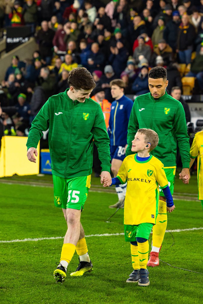 troppers85's tweet photo. What a moment for my boy walking out on the Carrow Road pitch with one of his favourite players. @Kellen11Fisher thank you for being brilliant with him, Olly loved the experience! https://t.co/PVSCTq91Rp
