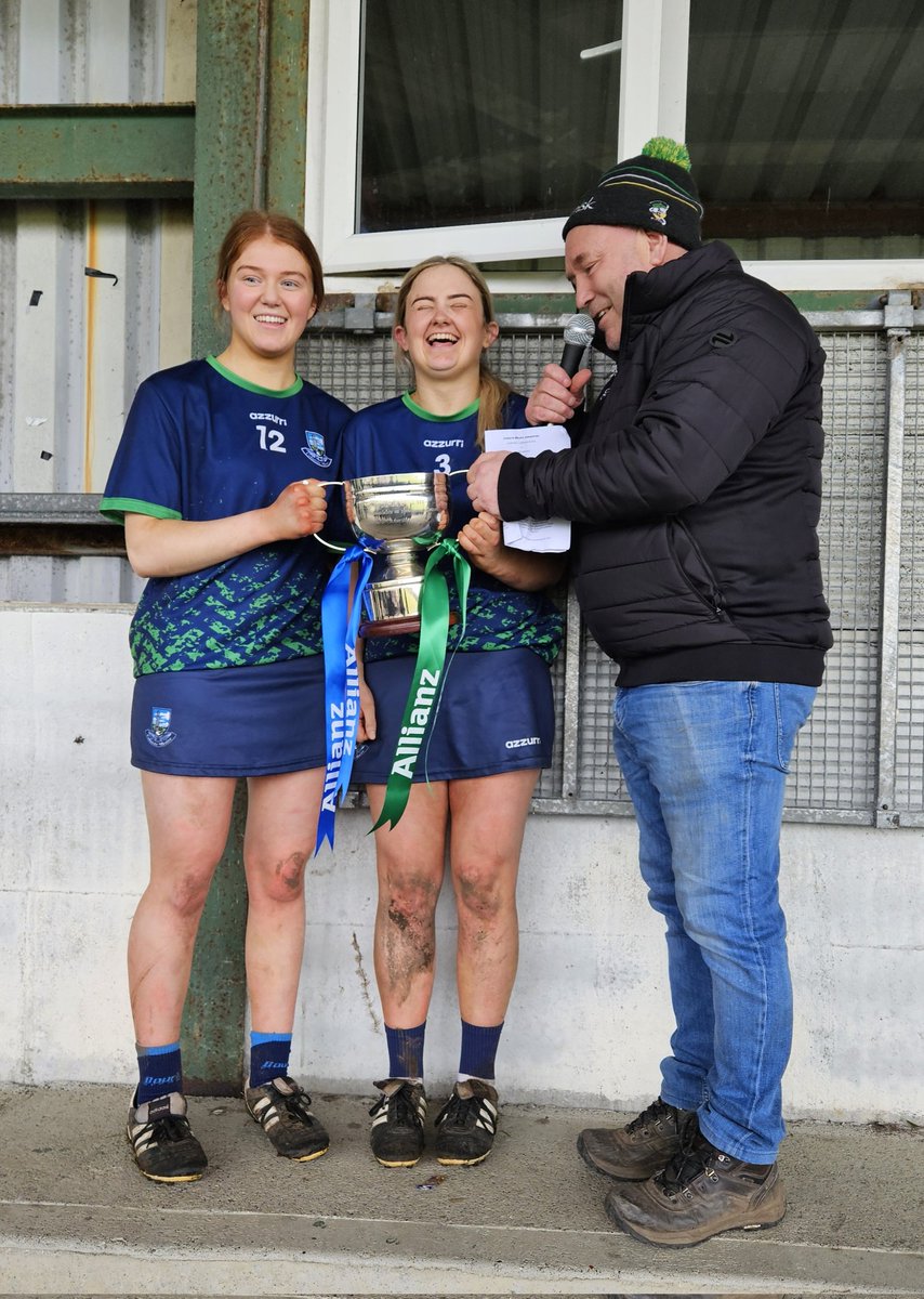 LCollsCamogie's tweet photo. After the All Ireland PP Schools Senior B Camogie Final:
Catherine Kirby and Kayla Dwyer,Coláiste Mhuire Johnstown receive The Mary Moran Cup  from Ronnie Byrne  (St Rynaghs Camogie Banagher). https://t.co/yb8nkZZAAj