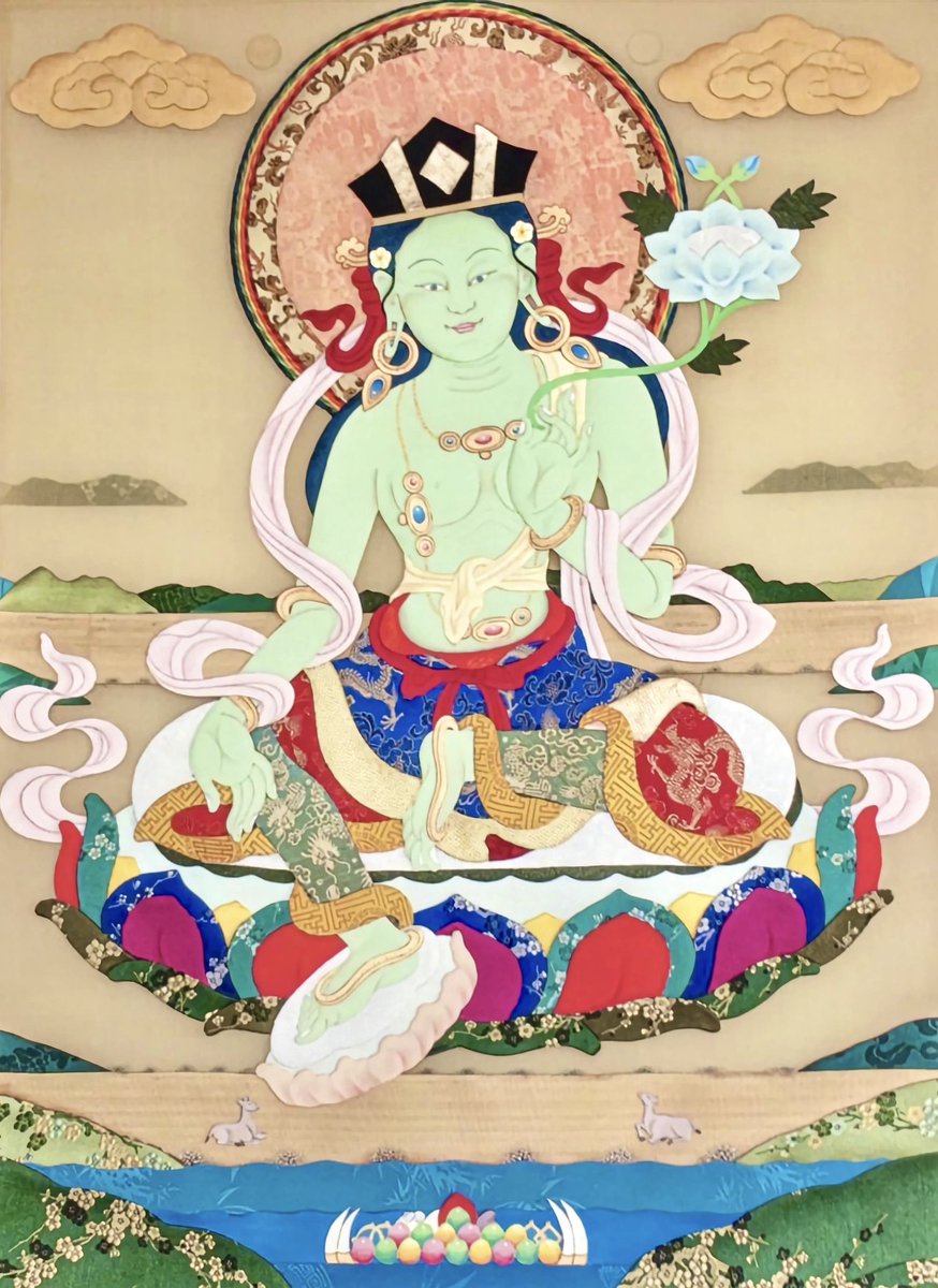 After His Holiness the 17th Karmapa, Ogyen Trinley Dorje, arrived in India, he reportedly had a vision of Green Tārā wearing the Black Hat. 

This version of the Karmapa's Black Hat Tārā is an appliqué artwork by Leslie Nguyen Temple, who requested the 17th Karmapa's permission