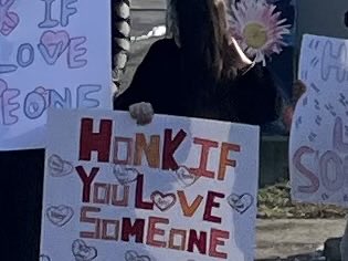 On Thursday, our students stood on a busy street with these signs. A beautiful moment of human connection. And noisy too!