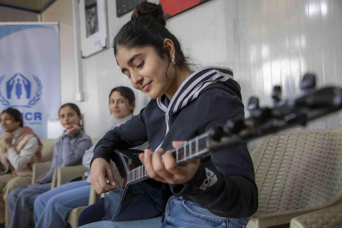 UNHCRIraq's tweet photo. UNHCR and partners provide music training and activities, helping refugees learn and thrive.

"Teaching music to children is part of growing a peaceful future," says Has, a Syrian refugee music teacher in Darashakran camp. https://t.co/9XhSeKPz4E