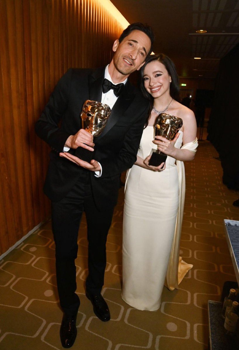 BAFTA Lead Actress winner Mikey Madison with BAFTA Lead Actor winner Adrien Brody. #EEBAFTAs