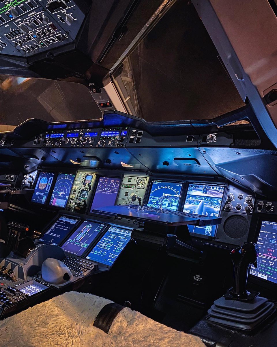 This stunning cockpit view belongs to a Qantas Airbus A380, captured from the First Officer’s seat. The ambient lighting, state-of-the-art displays, and the iconic sidestick control tell the story of one of the most advanced flight decks in commercial aviation.

In the image, the
