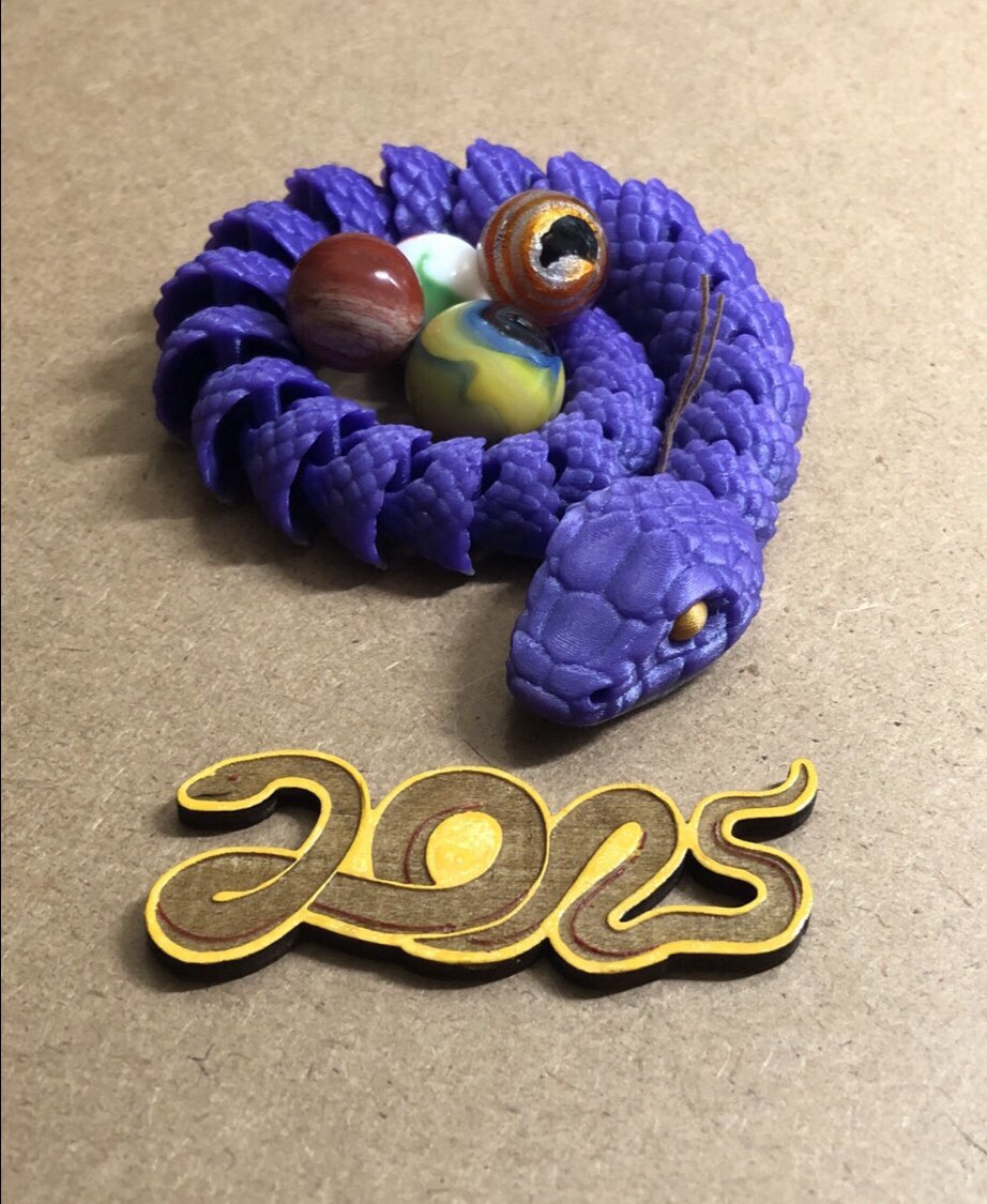 PartnerInShines's tweet photo. Finds post from the weekend. The @makeitmodit3d snake has been hoarding the marbles! 

Thanks to all the artists for sharing their work with the rest of us. #monkeyshines2025 https://t.co/a3UFRzCiyl