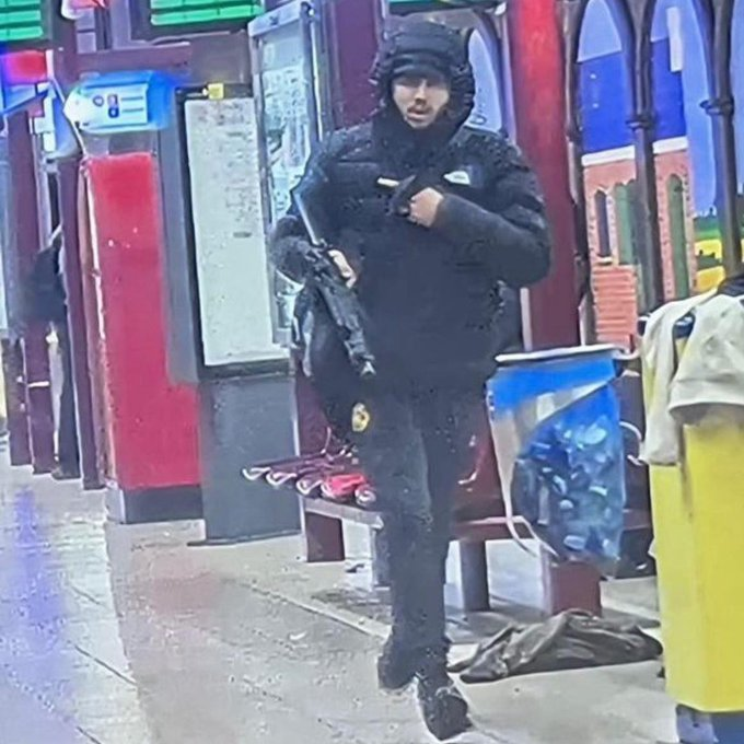 daveatherton's tweet photo. This allegedly an image of one of the Brussels gunman carrying an AK-47. He looks Welsh. https://t.co/Ij45PEZP5h