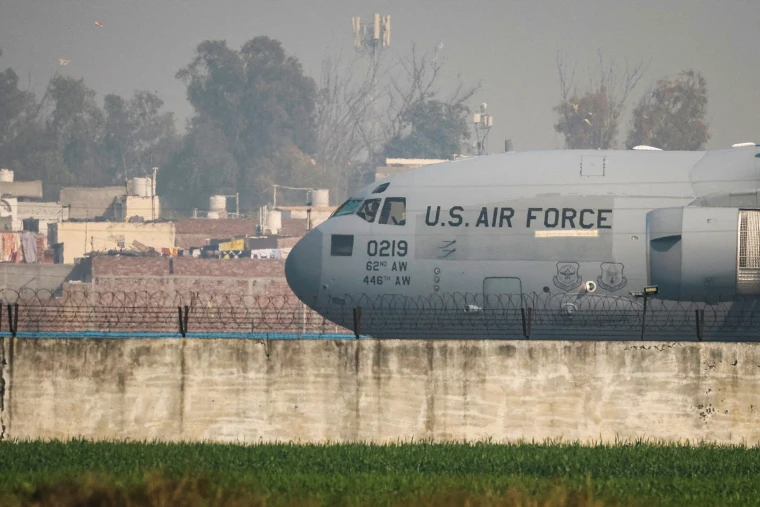 MariaKing25's tweet photo. US military plane lands in India with about 100 illegal immigrants on board

The flight is one of the recent deportations carried out using military aircraft.

A US military plane carrying dozens of illegal Indian citizens landed in northern India on Wednesday morning, according to a Reuters video report.

A defense official familiar with the situation told NBC News that there were about 100 illegal immigrants on board.

The flight is one of the recent deportations carried out using military aircraft. Last month, President Donald Trump signed an executive order giving the military a role in immigration enforcement and border security.