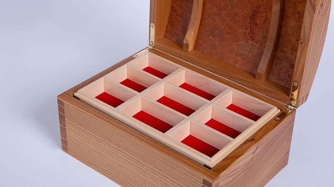 What could be better than a treasure chest to store your beloved jewellery?

This original jewellery box, handcrafted by Philip Sewell, is available at Artisan Alchemy Gallery in both elm and maple. Inside, you’ll find two velvet-lined trays, each with removable dividers!