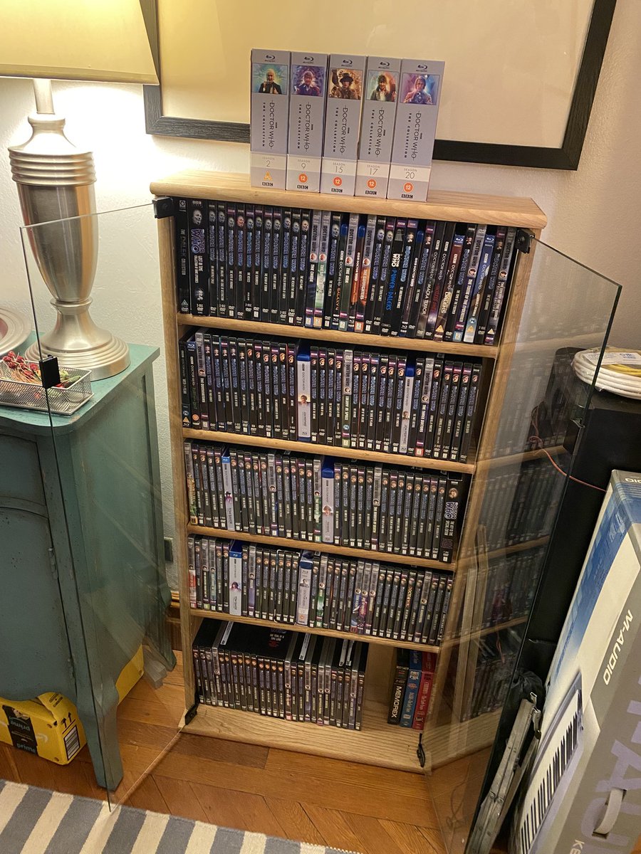 So thoroughly satisfying: a new cabinet for my Who DVDs ‘n’ Blu-rays. Alas, my Collections are too bulky to fit inside, an unanticipated issue. But they look beautiful on top, do they not? Thank you decibeldesigns.com!