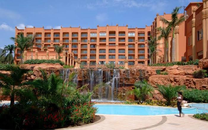T_E_F_L_O_N's tweet photo. Does the Aga Khan own Serena Hotel?

Yesterday, I shared that the arrested Accountant General started his career at the current Kampala Serena Hotel. Some people mistook it to mean that he owned it and were in the comments "informing" me that Aga Khan owns the facility, but does he?

The current ownership of Serena is as follows;

Tourism Promotion Services (TPS) 60%
NSSF 20%
PROPACO 20%

So where does the notion of Aga Khan owns Serena originate from?

TPS owns the Serena brand worldwide. 
TPS is a publicly traded company on the Nairobi Stock Exchange. However, the Aga Khan Fund for Economic Development owns 45% of the stock, and Aga Khan University Foundation owns 4%, putting the Aga Khan total stock at 49%.

So if TPS owns 60% of Kampala Serena, then the Aga Khan owns 49% of that, which is close to 30%, putting him above 20% of NSSF and PROPACO.

Who is PROPACO?

A private French finance development institution. However, the biggest shareholders at 79.8% is the AfD (French Development Agency) equivalent of USAID in France🤣🤣 other French finance institutions and investment funds own the rest of the shares.

What is more important to note is that the next time @nssfug announces interest due to workers remember part of it is from Kampala Serena Hotel.

NB: 1st frame is the new Aga Khan V who succeeds his father, the Aga Khan IV. If you are interested in the history and religious empire of the Aga Khan repost and I will dissect it for you tomorrow morning.