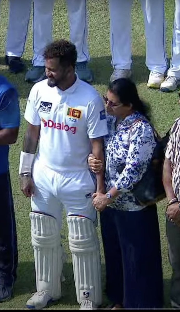 afidelf's tweet photo. Favourite part of the little pre-Test ceremony for Dimuth Karunaratne, was his mother clutching his arm like a nervous parent dropping her child off for his first day of school. 

You can play 100 Tests, but you'll always be their baby. https://t.co/1eeg7KBWoU