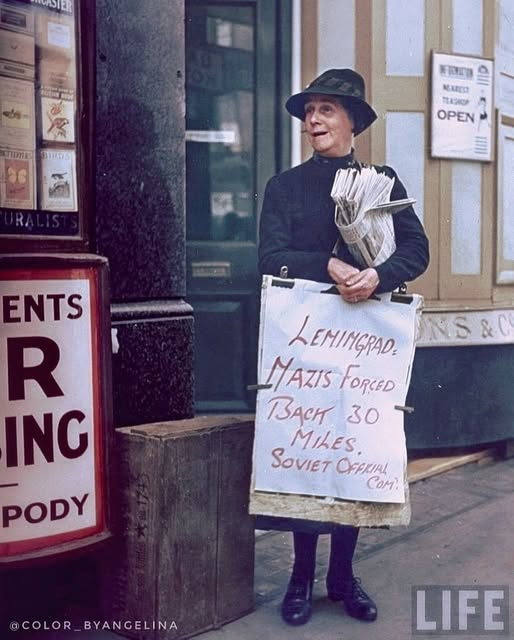 starside8's tweet photo. History In Color
A newspaper saleswoman selling papers in London, England holding a poster with the main news of the day "Leningrad, Nazis forced back 30 miles. Soviet Official Com." Photo taken in 1943.
Credit: color_byangelina on Instagram⁠
#HistoryInColor