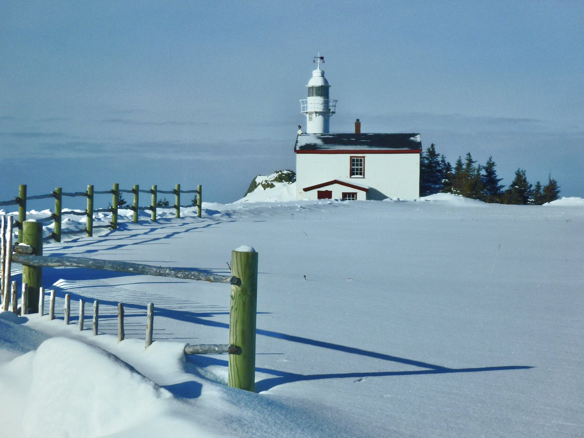 A winter scene of the lighthouse in Rocky Harbour.