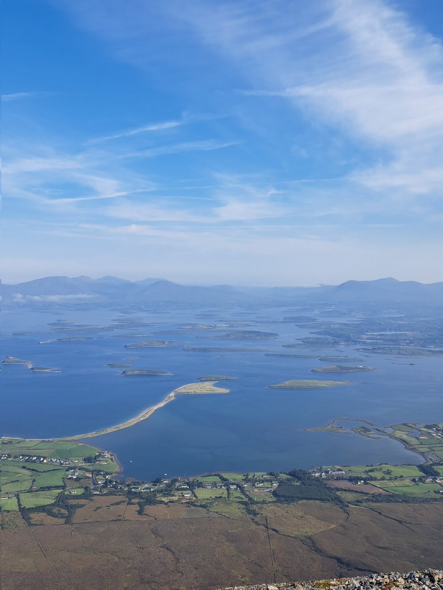 A shot from the top of our hike up Croagh Patrick. Reda on 👇👇

Croagh Patrick is a famous mountain in County Mayo, Ireland, known for its religious and historical significance. Standing at 764 meters (2,507 feet), it is a popular pilgrimage site, especially on Reek Sunday (the