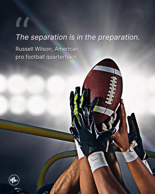 "A football player holding a ball in raised hands against a blurred stadium background. The image features the quote 'The separation is in the preparation.' by Russell Wilson, American pro football quarterback, overlaid at the top in white text."