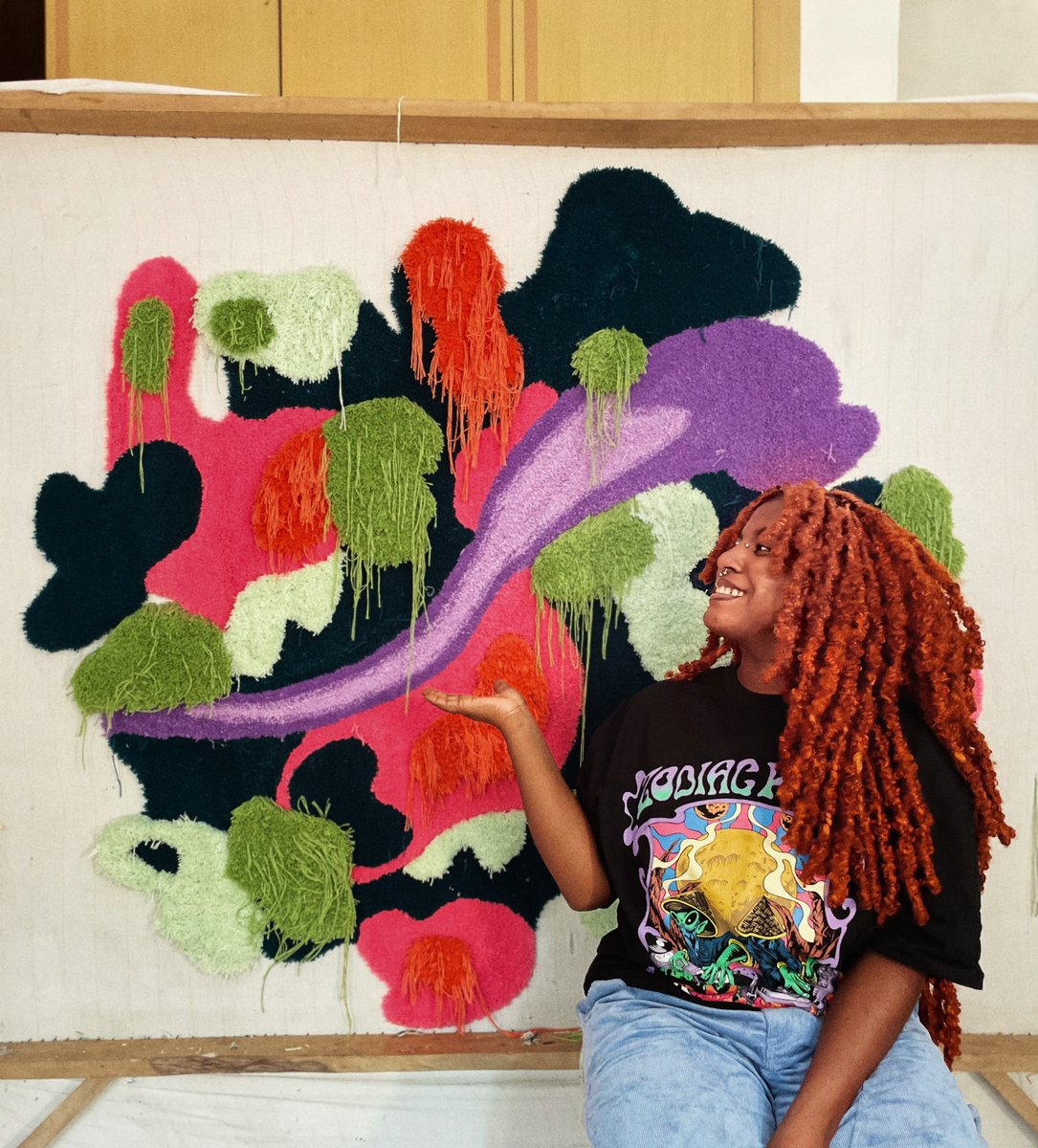 Hi, i'm cynthia, i'm a multi disciplinary artist and sometimes i make beautiful rugs❤️•- like this one behind me!