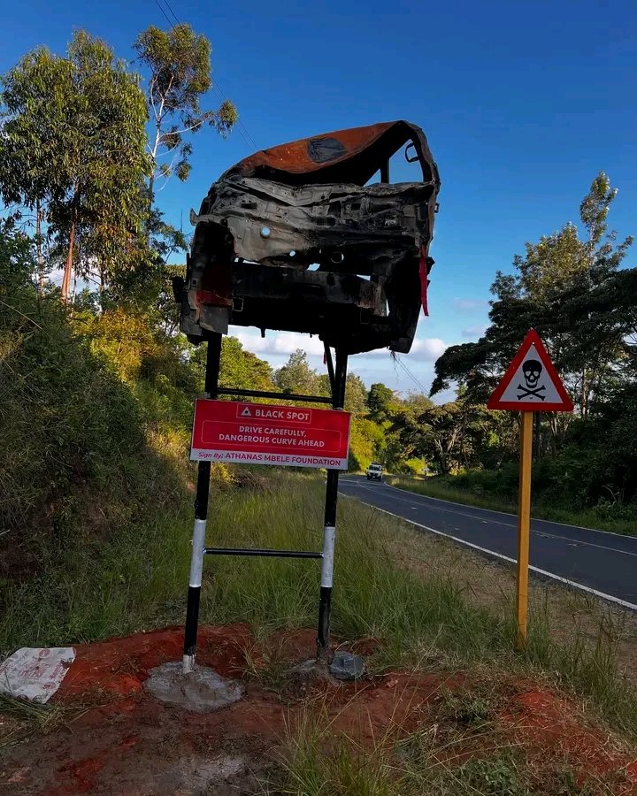 mbelefoundation's tweet photo. After the tragic accident at JOSA hotspot, the Athanas Mbele Foundation has put up a warning sign to improve road safety. 

The hanged burned car, now serves as a reminder for drivers to slow down and be careful. Let’s stay alert and drive safely to prevent more tragedies. https://t.co/DISlL7HKnT